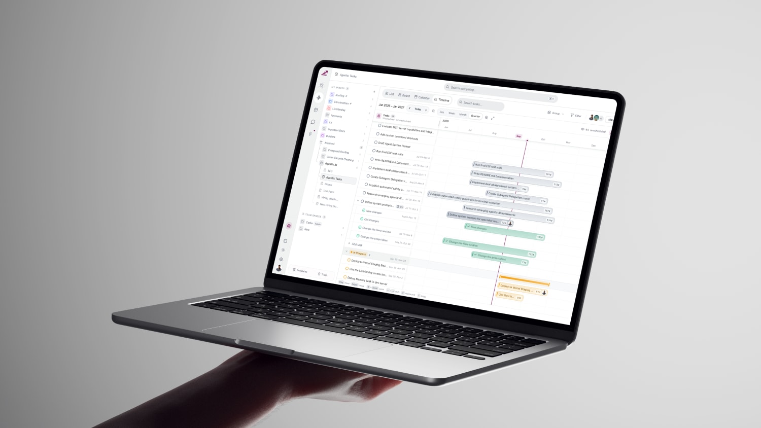 Workexis timeline view on a laptop held in one hand